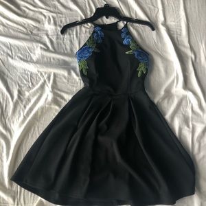 Black fit and flare dress with blue floral details